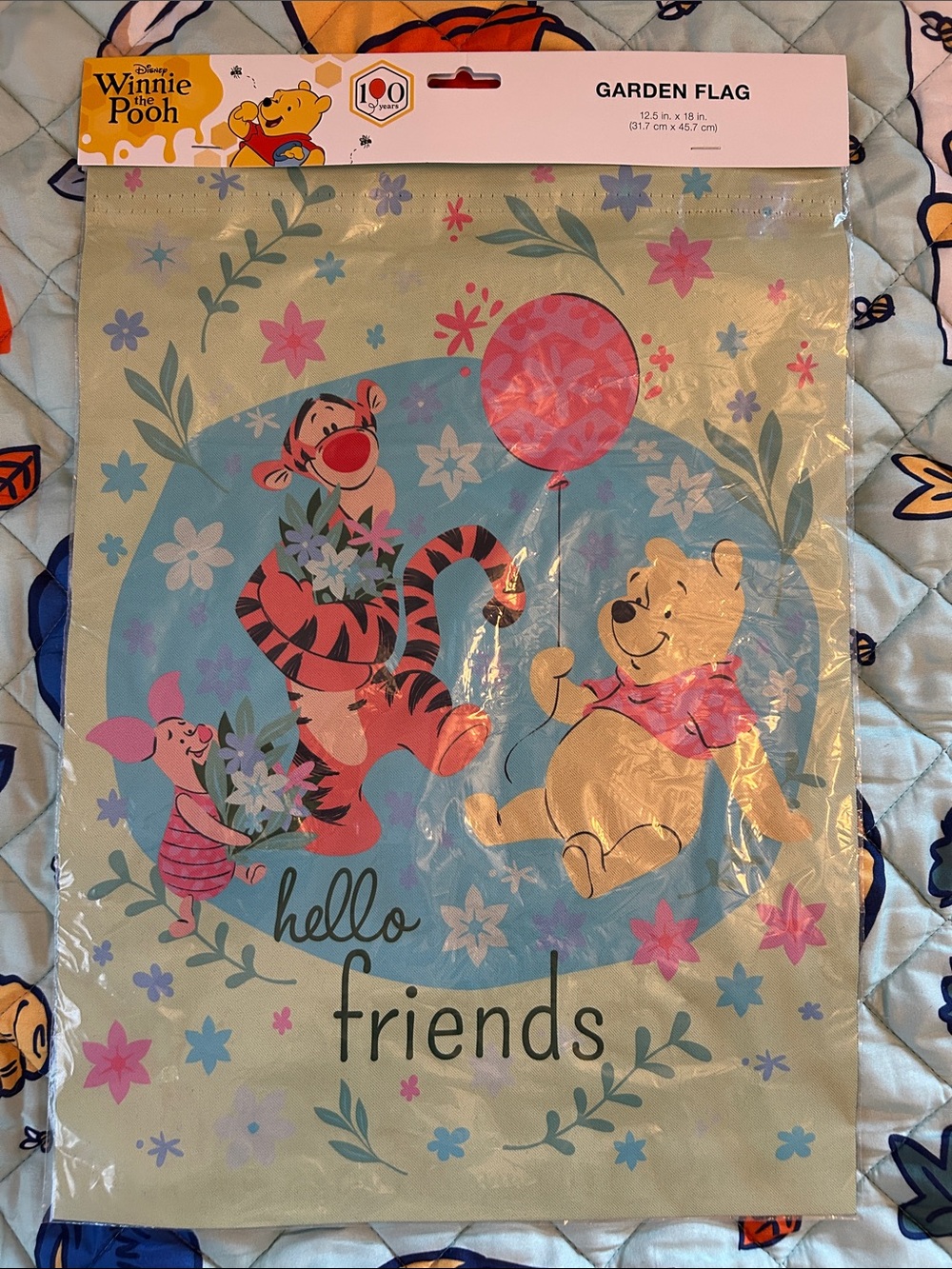 Winnie the Pooh Floral Garden Flag that says “Hello Friends”